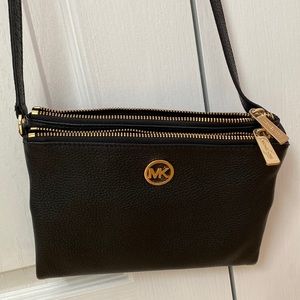 Michael Kors black crossbody purse with matching mini pink wallet